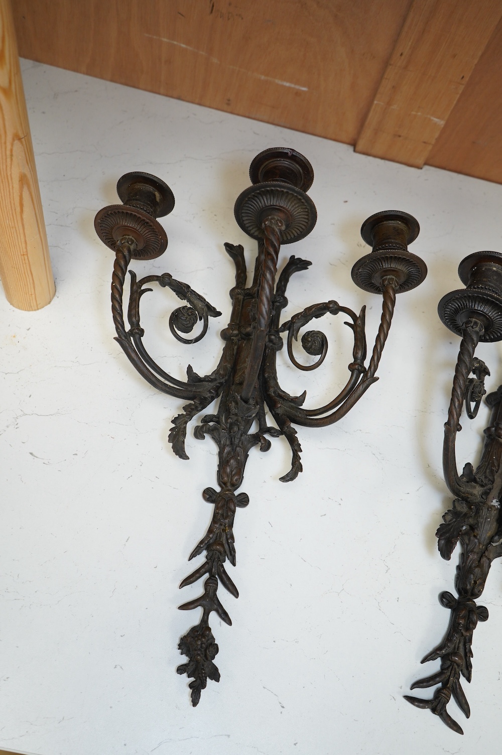 Two, three branch ornate metal sconces, tallest 46cm high. Condition - one has piece missing from the end